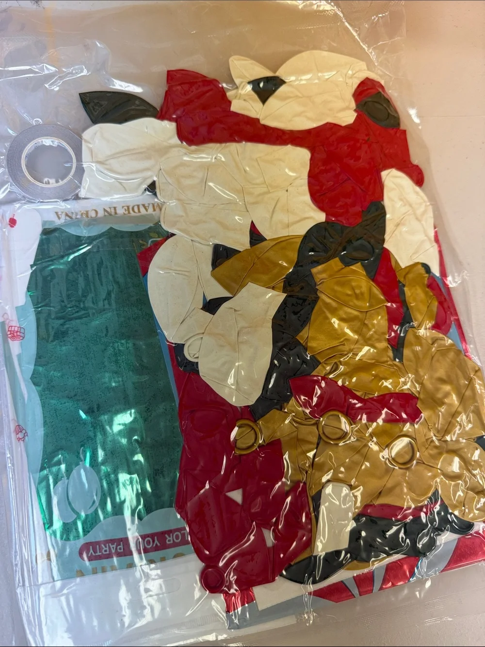 Christmas Party Decorations in a bag foil fringe curtains mylar balloons and lat